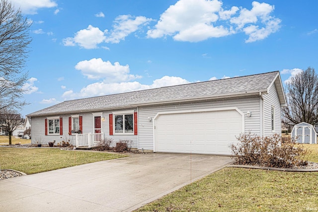 ranch-style home featuring concrete driveway, roof with shingles, an attached garage, a shed, and a front yard