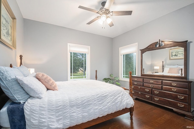 bedroom featuring ceiling fan and dark wood-type flooring