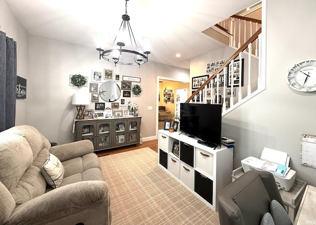 living room with recessed lighting, a notable chandelier, wood finished floors, baseboards, and stairs