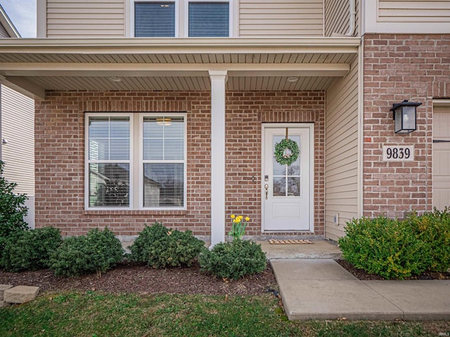 property entrance with brick siding