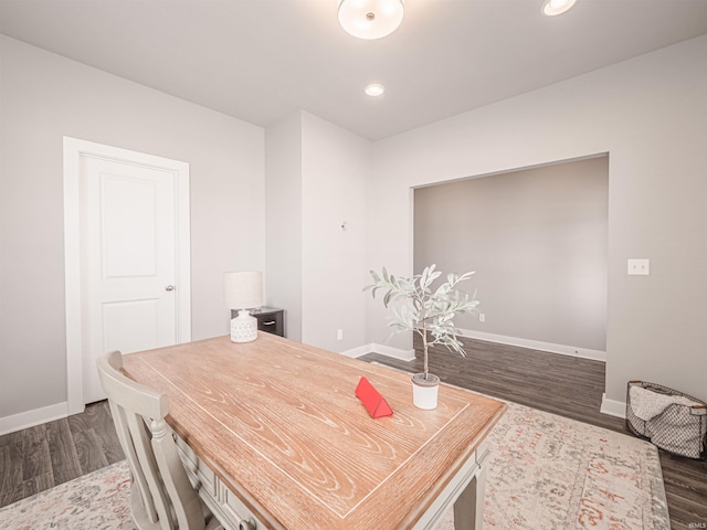 dining room featuring dark wood-style floors, baseboards, and recessed lighting