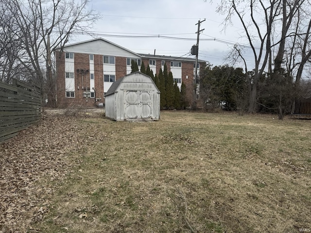 view of yard featuring a shed and an outdoor structure