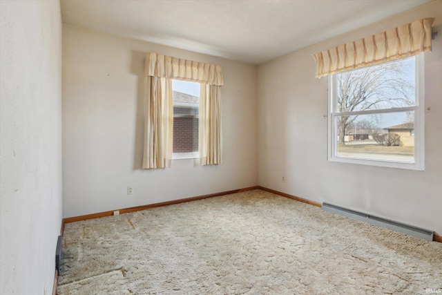 carpeted spare room featuring a baseboard radiator and baseboards