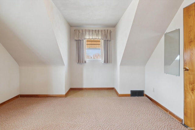 bonus room featuring carpet, visible vents, and baseboards