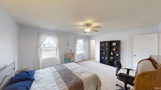 bedroom with carpet floors, ceiling fan, and baseboards