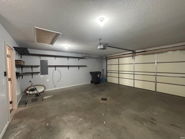 garage with a garage door opener, electric panel, and baseboards