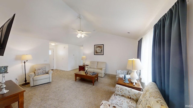 living area with lofted ceiling, carpet, a ceiling fan, and baseboards