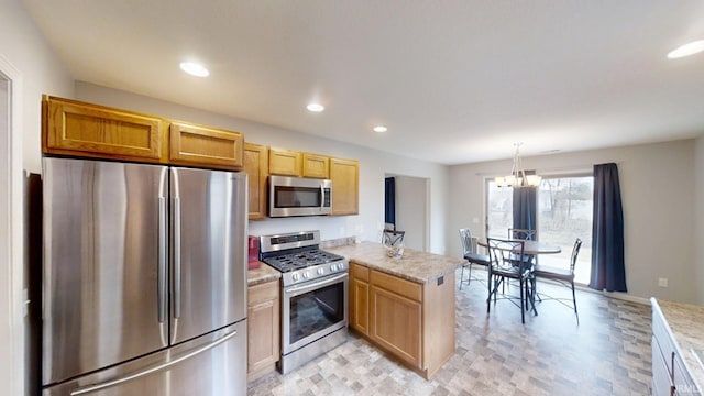 kitchen featuring recessed lighting, stainless steel appliances, a peninsula, an inviting chandelier, and pendant lighting