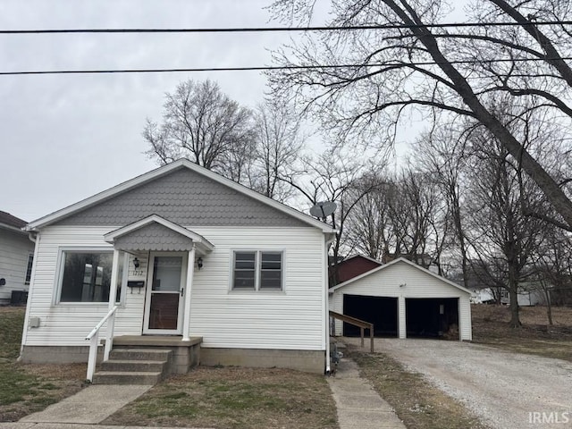 bungalow-style home with an outbuilding and a garage