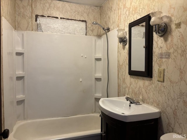 full bathroom featuring shower / bath combination, wallpapered walls, toilet, and vanity