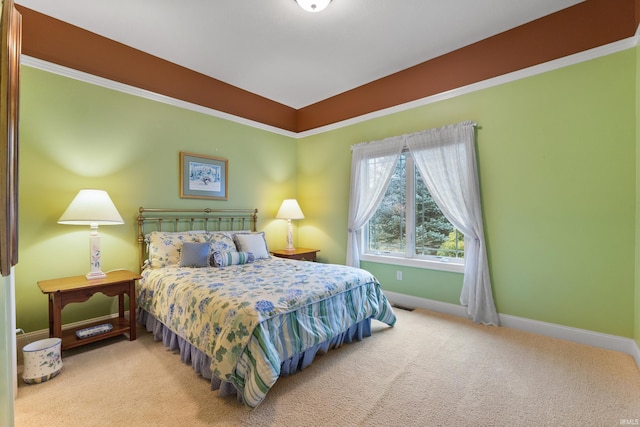 carpeted bedroom featuring baseboards