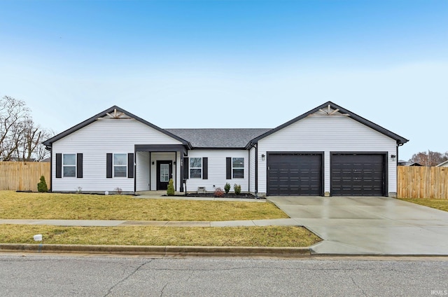 ranch-style house with roof with shingles, fence, a garage, driveway, and a front lawn