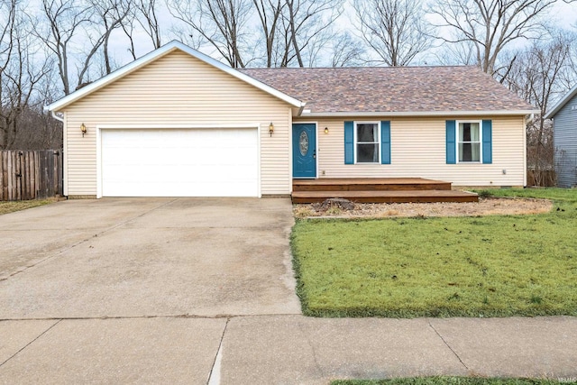 ranch-style home featuring a garage, driveway, roof with shingles, fence, and a front yard