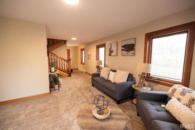 living room featuring light carpet, stairs, baseboards, and recessed lighting