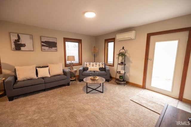 living room featuring light colored carpet, baseboards, and a wall mounted AC