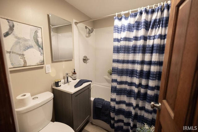 bathroom with vanity, shower / bath combo with shower curtain, and toilet