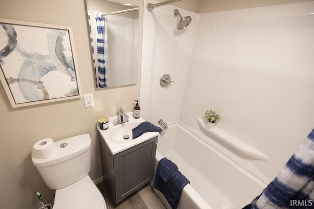 full bath with shower / bath combo, vanity, and toilet