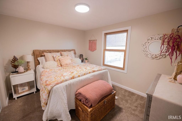 carpeted bedroom featuring baseboards