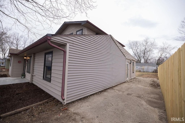 view of property exterior with fence