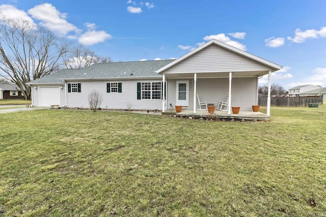 ranch-style home featuring covered porch, concrete driveway, an attached garage, fence, and a front lawn