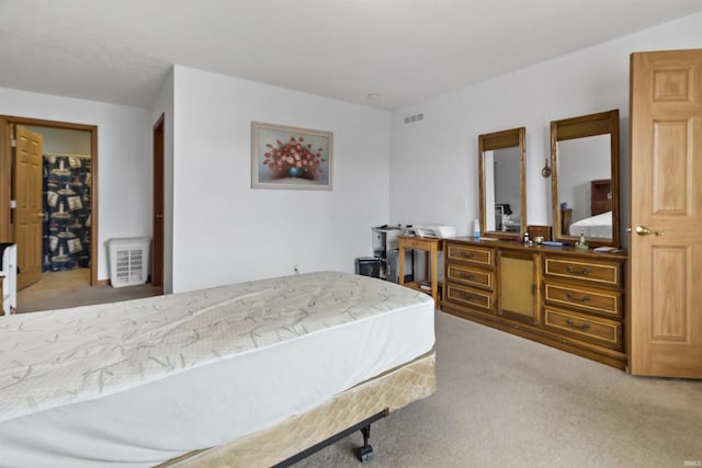 carpeted bedroom with visible vents