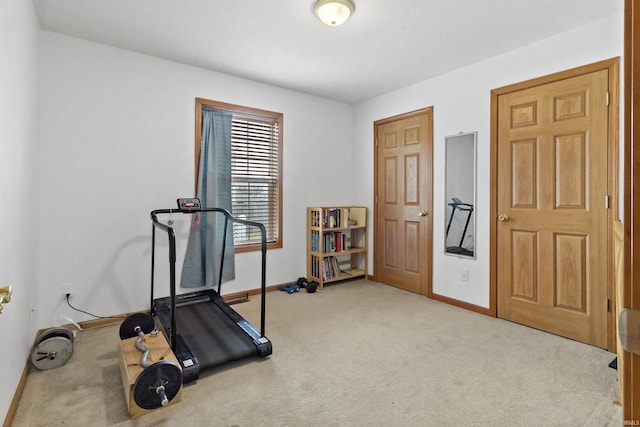 exercise area with carpet and baseboards