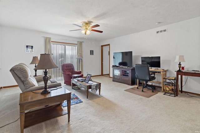 office area featuring ceiling fan, carpet floors, visible vents, and baseboards