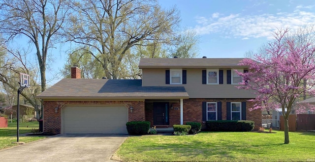 traditional home featuring brick siding, a chimney, an attached garage, driveway, and a front lawn