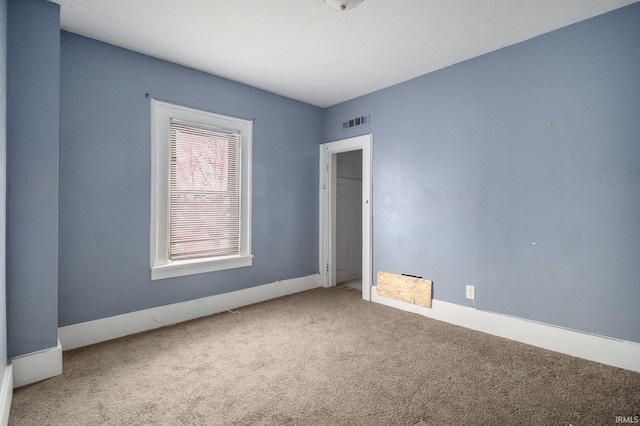 unfurnished bedroom with carpet and visible vents