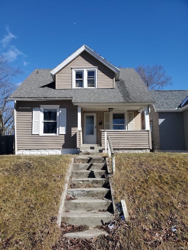 bungalow with a shingled roof and a porch