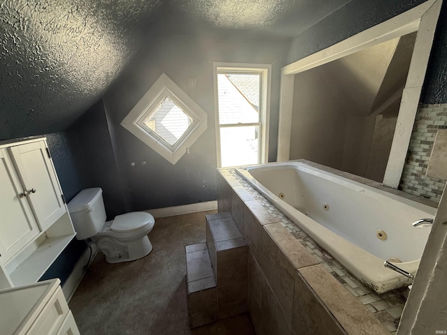 bathroom with a textured ceiling, lofted ceiling, toilet, baseboards, and a whirlpool tub