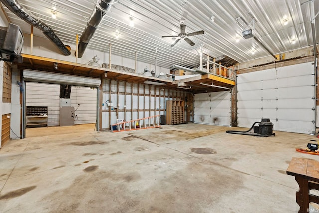 garage featuring metal wall and a garage door opener