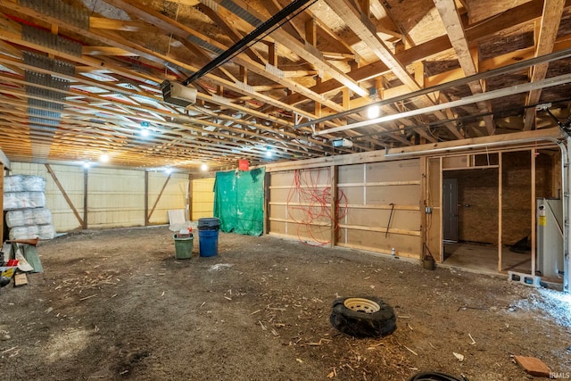 interior space with a garage and water heater