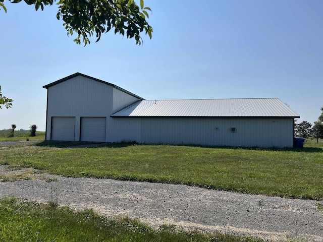 view of pole building with a lawn