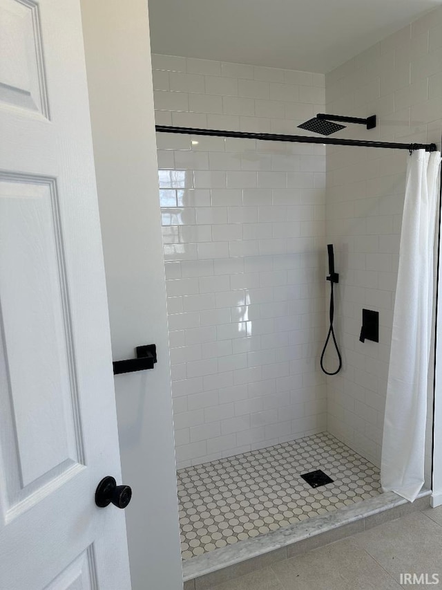 full bathroom featuring a shower stall