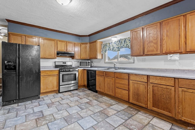 kitchen featuring a textured ceiling, under cabinet range hood, a sink, light countertops, and black appliances