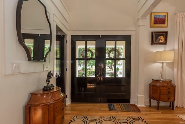 entryway featuring french doors and wood finished floors