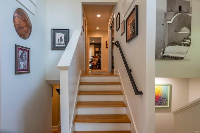 stairway featuring recessed lighting