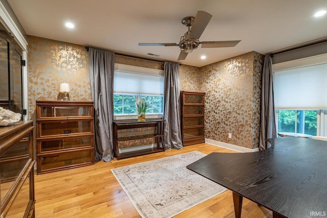 bedroom featuring recessed lighting, wood finished floors, visible vents, and wallpapered walls