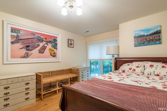 bedroom with visible vents and light wood finished floors