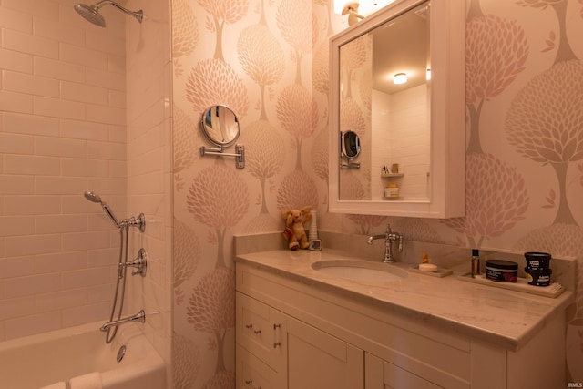 full bath with vanity, shower / bathtub combination, and wallpapered walls