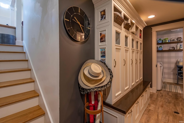 mudroom featuring light wood-style floors, recessed lighting, washer / clothes dryer, and baseboards