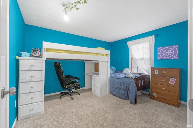 bedroom featuring carpet flooring and baseboards