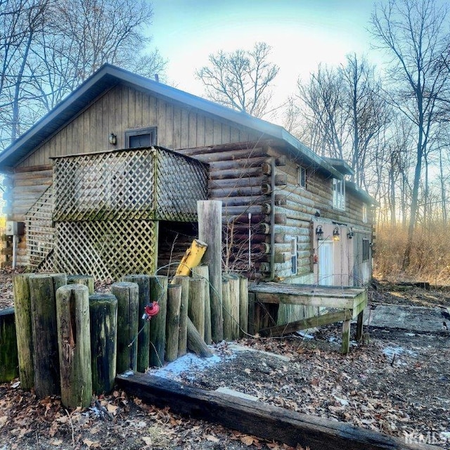 view of property exterior featuring log siding