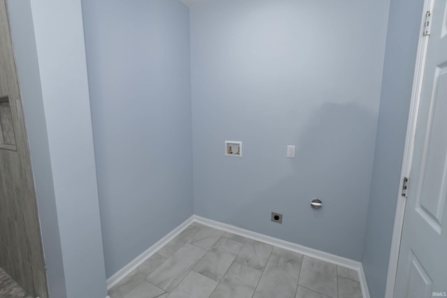 laundry area featuring baseboards, laundry area, hookup for a washing machine, and hookup for an electric dryer