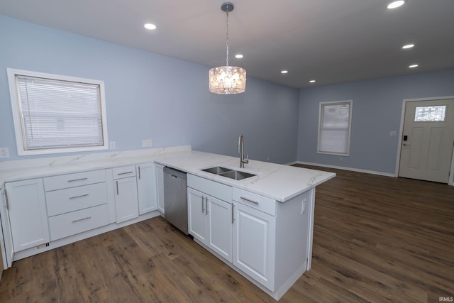 kitchen with recessed lighting, a peninsula, a sink, white cabinets, and dishwasher