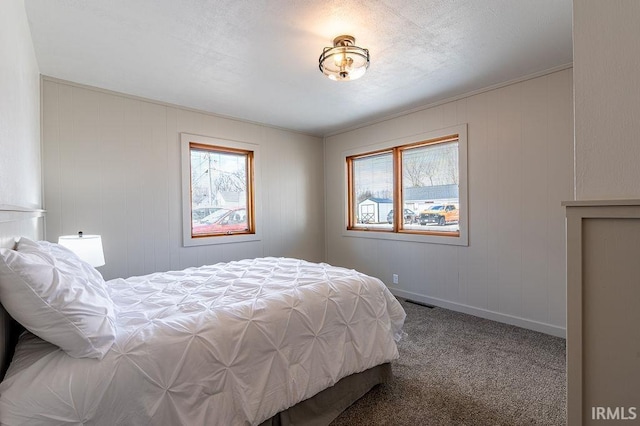 carpeted bedroom featuring visible vents and baseboards