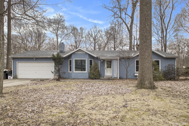 ranch-style house with a garage, driveway, and a chimney