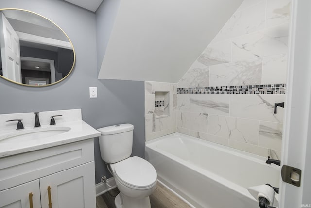 full bath with toilet, tub / shower combination, vanity, wood finished floors, and baseboards