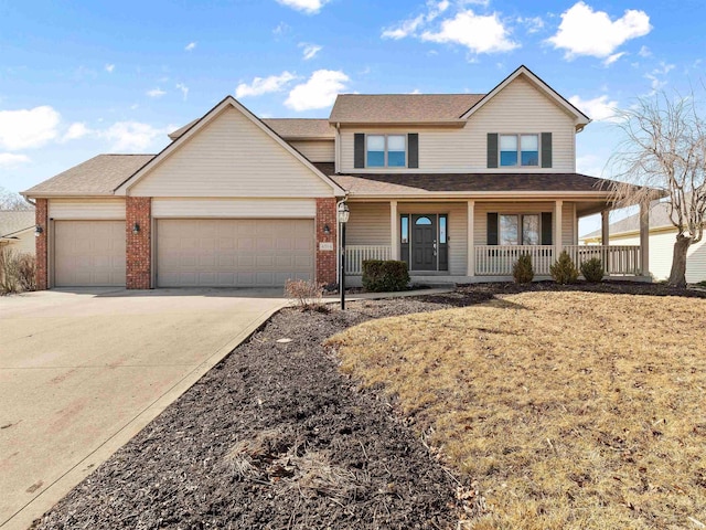 view of front of property featuring an attached garage, covered porch, driveway, and brick siding